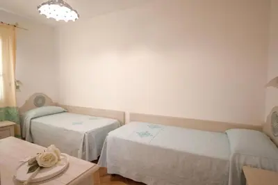 Letto o letti in una camera di Superb Le Residenze del Golfo di Orosei num2192