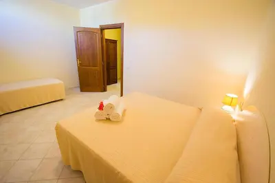 Letto o letti in una camera di Relaxing Le Residenze del Maria Rosaria no2213