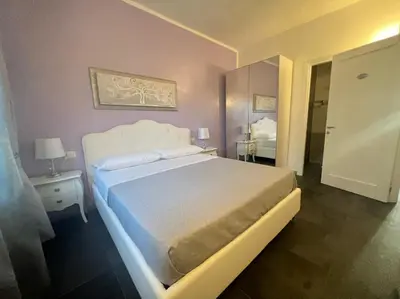 Letto o letti in una camera di Acquamarina Luxury Rooms