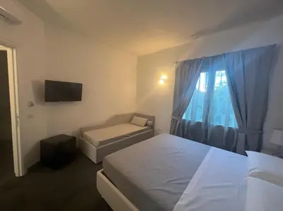 Letto o letti in una camera di Acquamarina Luxury Rooms