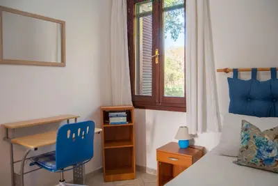 Letto o letti in una camera di Casa Maddalena