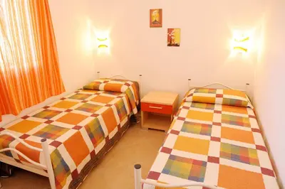 Letto o letti in una camera di Case Vacanze Budoni Beach