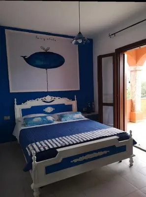 Letto o letti in una camera di Casa Sara San Teodoro