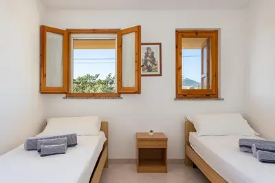 Letto o letti in una camera di Anna's apartment - Paradise by the Sea
