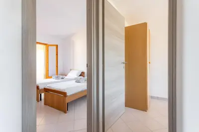 Letto o letti in una camera di Anna's apartment - Paradise by the Sea