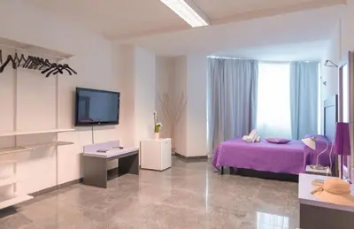 Letto o letti in una camera di Delta Rooms