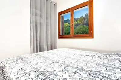 Letto o letti in una camera di Villino Tiriddò di Porto San Paolo