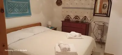 Letto o letti in una camera di Finestra sul mare