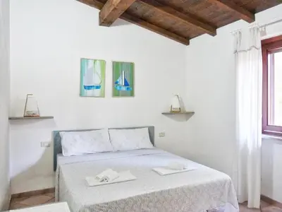 Letto o letti in una camera di Le Caterine