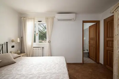 Letto o letti in una camera di Villa Corallo