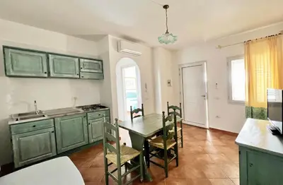 Cucina o angolo cottura di Residence in Orosei apartments with air conditioning and private outdoor area