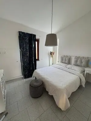 Letto o letti in una camera di Teodora e Teodorina bohemien house