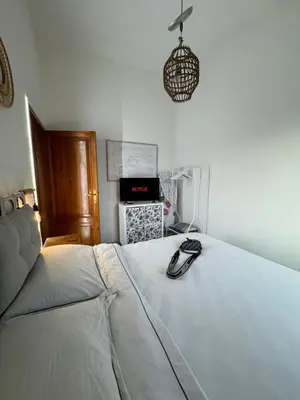Letto o letti in una camera di Teodora e Teodorina bohemien house