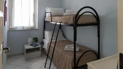 Letto o letti in una camera di Green and Blue vista mare Cala Gonone