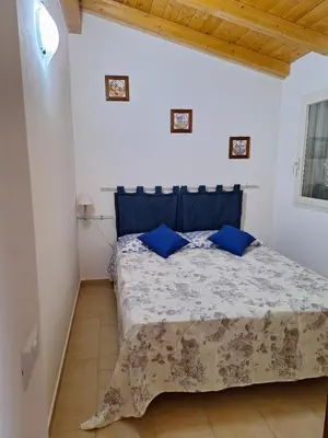 Letto o letti in una camera di Casa Maria