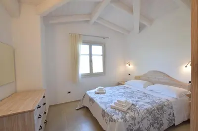 Letto o letti in una camera di Villa Helios