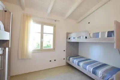 Letto o letti in una camera di Villa Helios