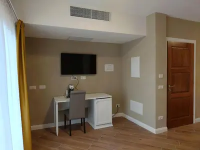 TV o dispositivi per l'intrattenimento presso RMaison Luxury Suites Olbia