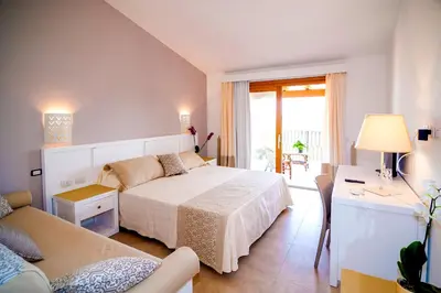 Letto o letti in una camera di Stella Marina Budoni