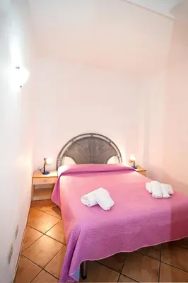Letto o letti in una camera di Stella Marina Budoni
