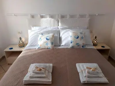 Letto o letti in una camera di Casa Minuredda
