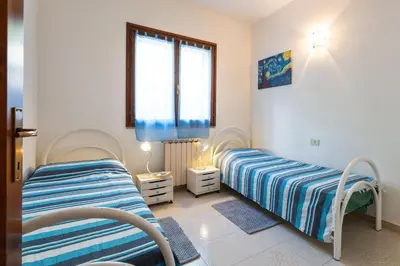 Letto o letti in una camera di CASA AGRUSTOS PANORAMICA