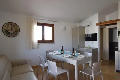 Cucina o angolo cottura di Luisa Apartment In Budoni, Shared Pool