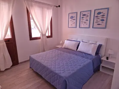 Letto o letti in una camera di CASA VACANZE ONDA BLU