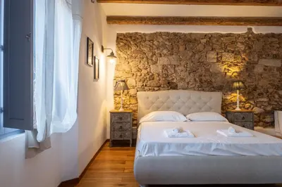 Letto o letti in una camera di Dimoras Stone Suites