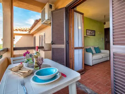 Area soggiorno di Apartment F4 - F2- Baia de Bahas by Interhome