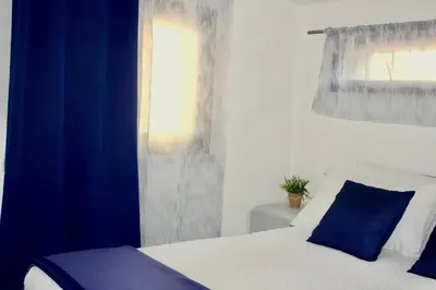 Letto o letti in una camera di Casa Moderna