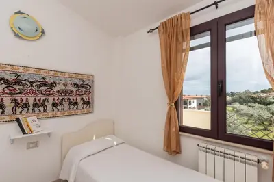 Letto o letti in una camera di Casa Marta