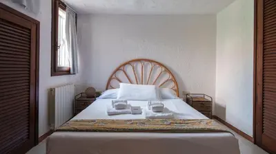 Letto o letti in una camera di Acqua e Tramonto