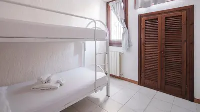Letto o letti in una camera di Acqua e Tramonto