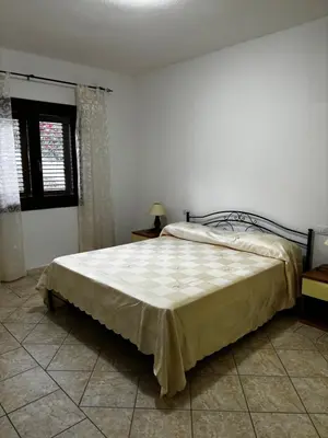 Letto o letti in una camera di Appartamento vista Mare Tanaunella