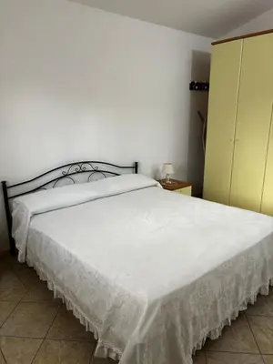 Letto o letti in una camera di Appartamento vista mare Tanaunella