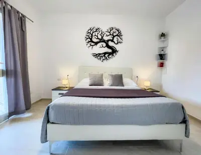 Letto o letti in una camera di Atmosphera, Appartamento 180 m dalla Terza Spiaggia