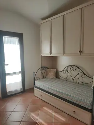Letto o letti in una camera di B1 Lu Maestrali 1Piano