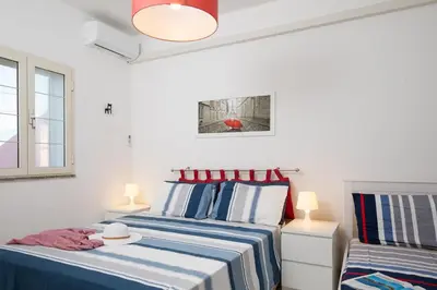Letto o letti in una camera di Casa Marisa by Wonderful Italy