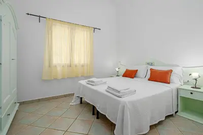 Letto o letti in una camera di Tenuta Lu Baroni