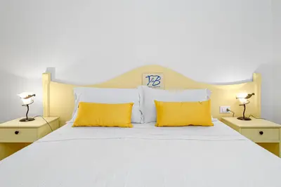 Letto o letti in una camera di Tenuta Lu Baroni