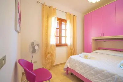 Letto o letti in una camera di Capo Comino 1