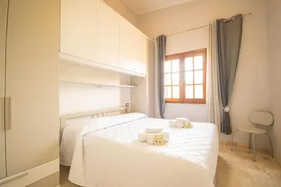 Letto o letti in una camera di Capo Comino 2