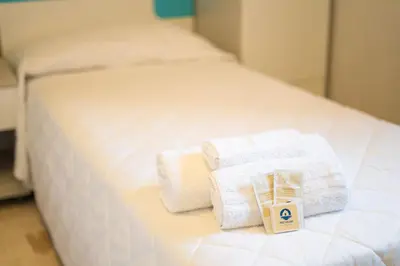 Letto o letti in una camera di Capo Comino 2