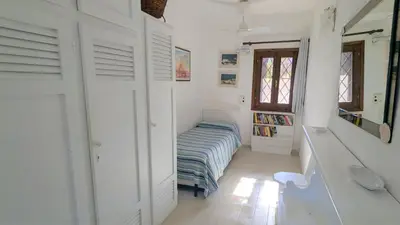 Letto o letti in una camera di Appartamento vista mare a 150m dalla spiaggia