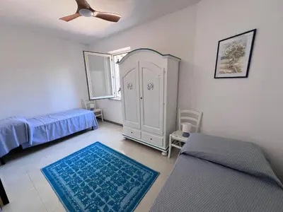 Letto o letti in una camera di Marzy Home