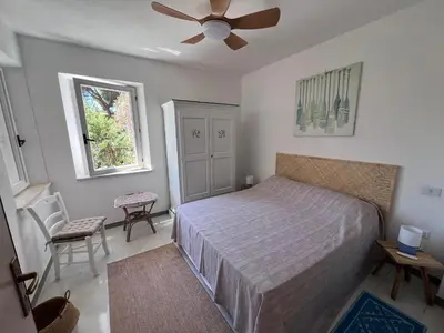 Letto o letti in una camera di Marzy Home