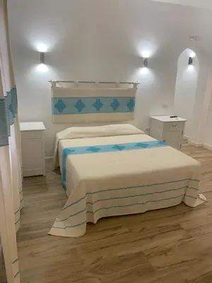 Letto o letti in una camera di Budoni Beach Apartments