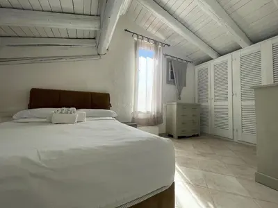Letto o letti in una camera di Punta Est Trilocale Splendida Vista Mare