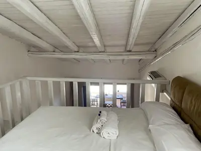 Letto o letti in una camera di Punta Est Trilocale Splendida Vista Mare